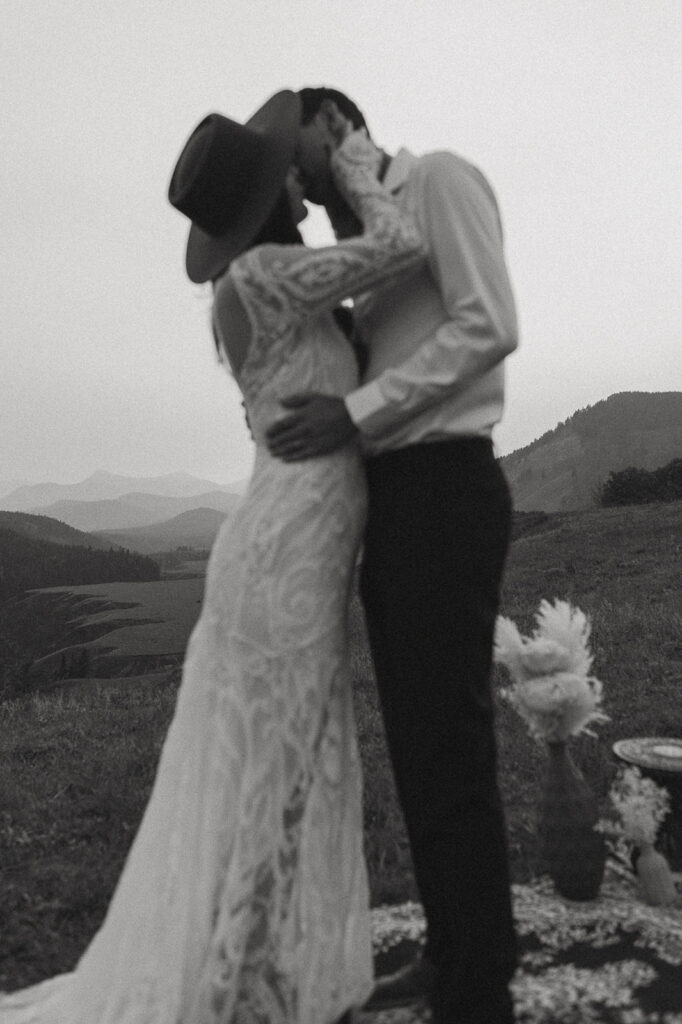 bride and groom sharing a kiss post their elopement ceremony