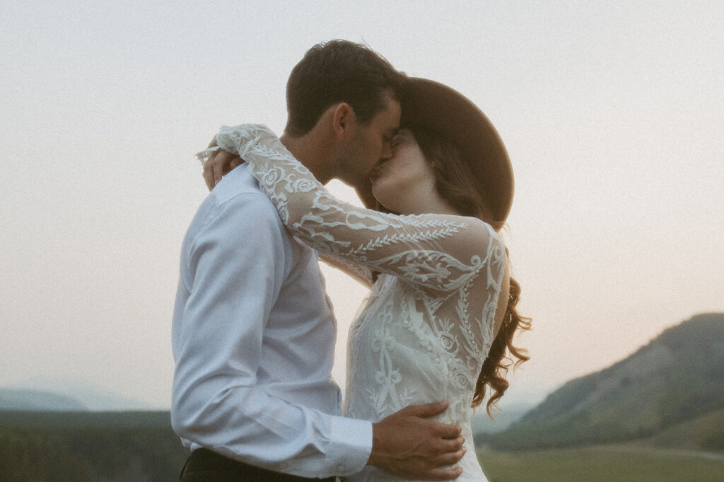 bride and groom kiss