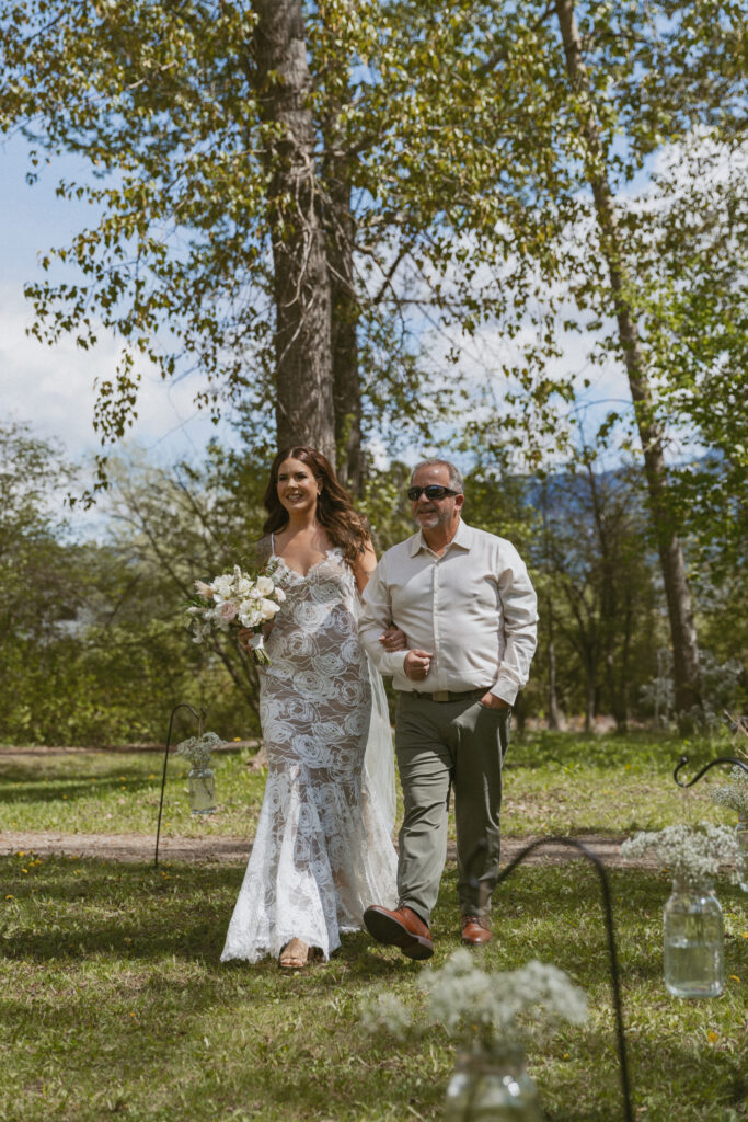 bride walking down aisle at fernie, BC wedding location