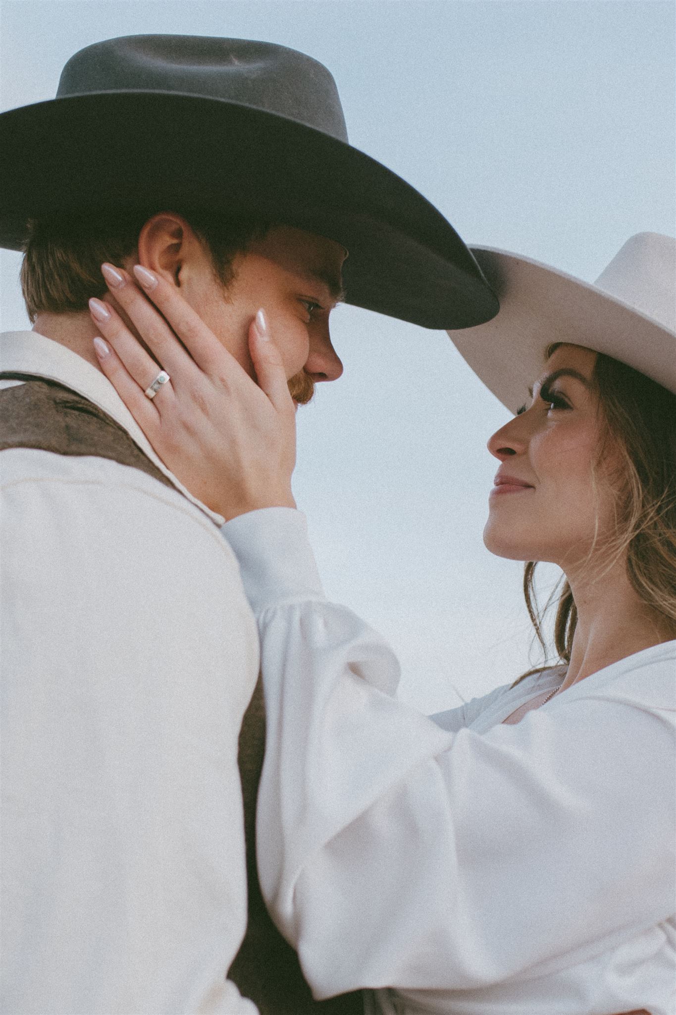 bride and groom embrace during their alberta wedding