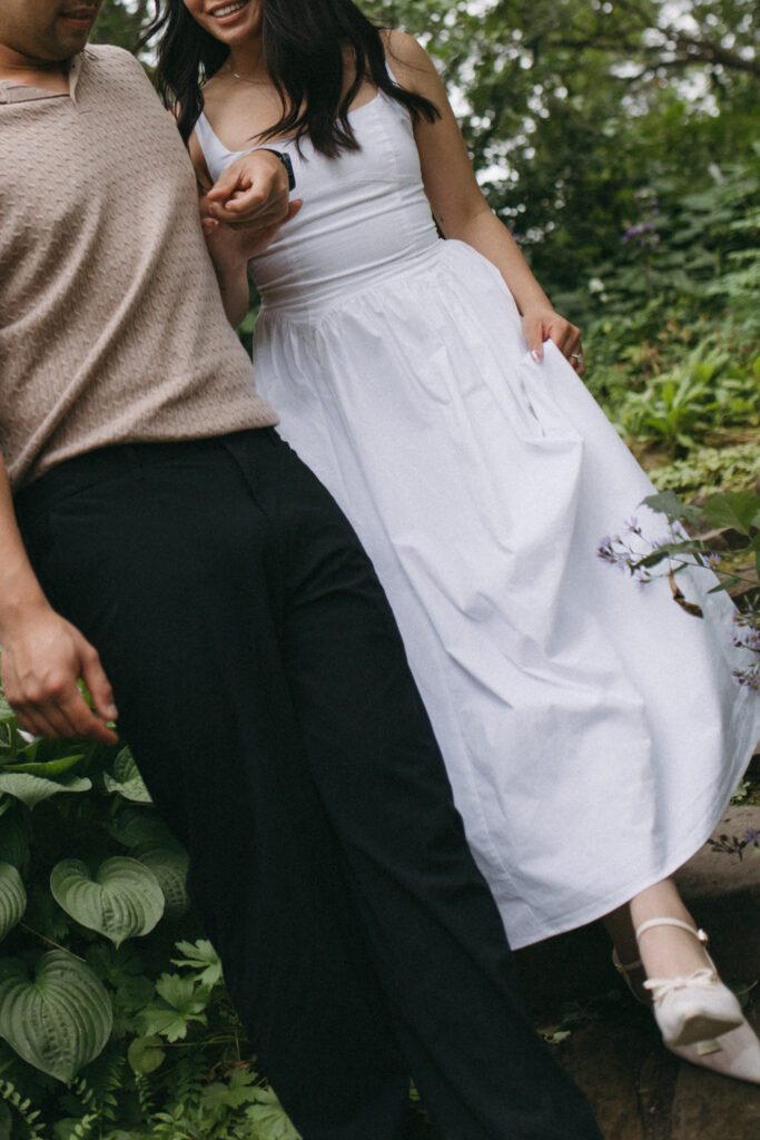 Close-up of Lisa and Peter holding hands in Reader Rock Garden, Alberta engagement photographer capturing tender moments.