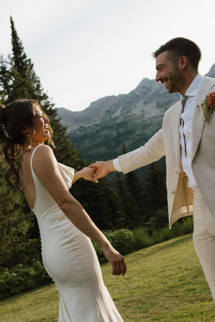 Golden hour wedding portraits outside of Island Lake Lodge captured by Fernie wedding photographer