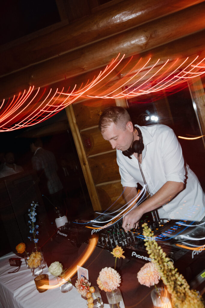 Friends DJing wedding reception dance floor at Island Lake Lodge