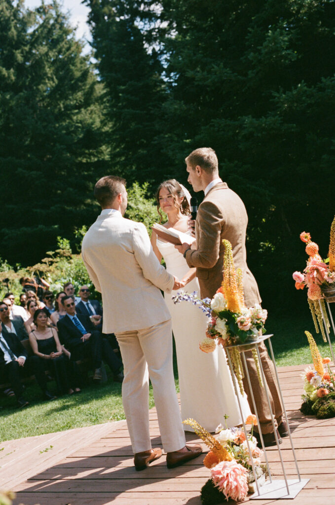 Wedding ceremony in front of the Lizard Range mountains at Island Lake Lodge