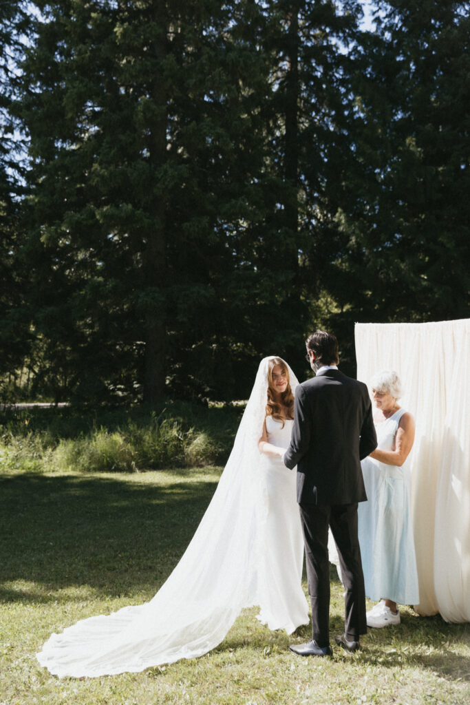 bride and groom stand at alter at their calgary wedding
