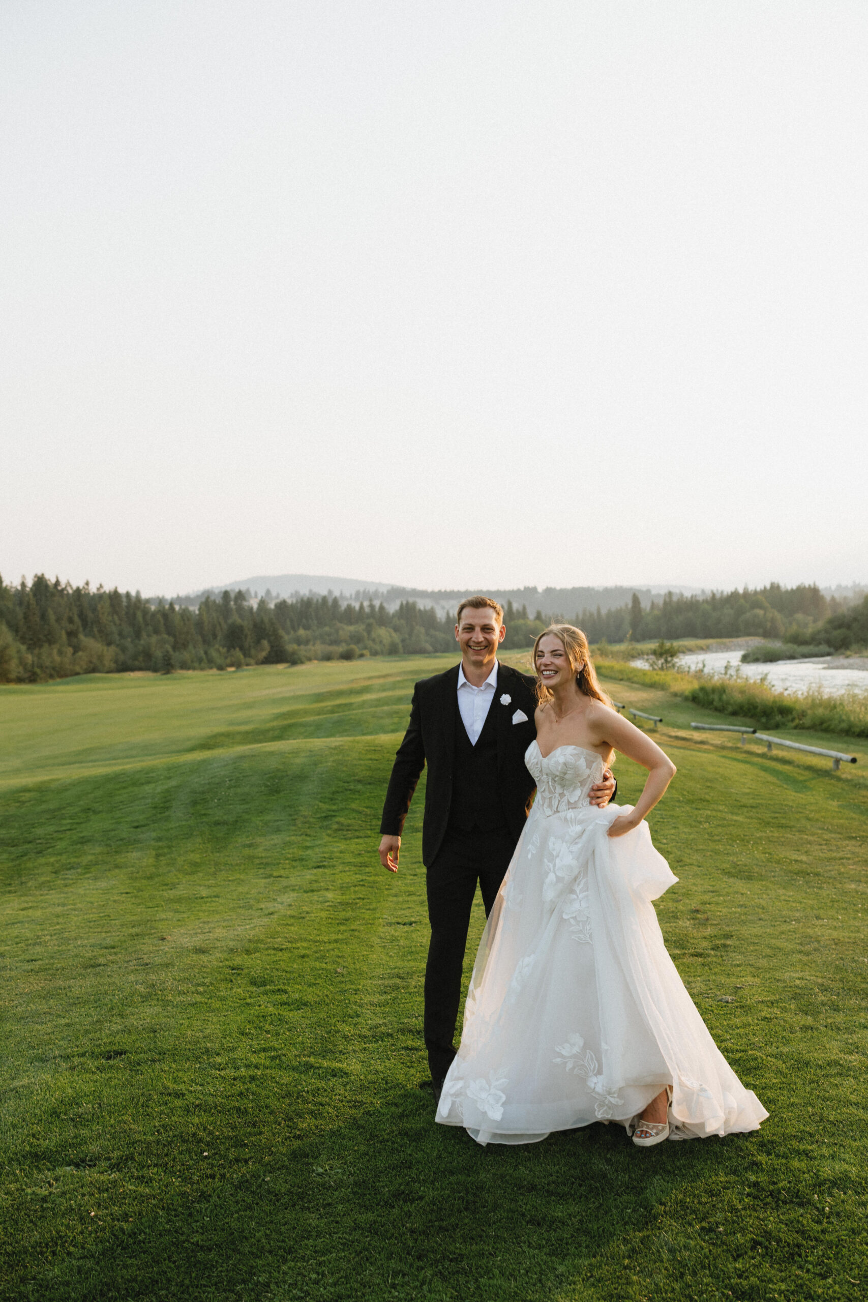 bride and groom during golden hour at their st. eugene cranbrook wedding in bc