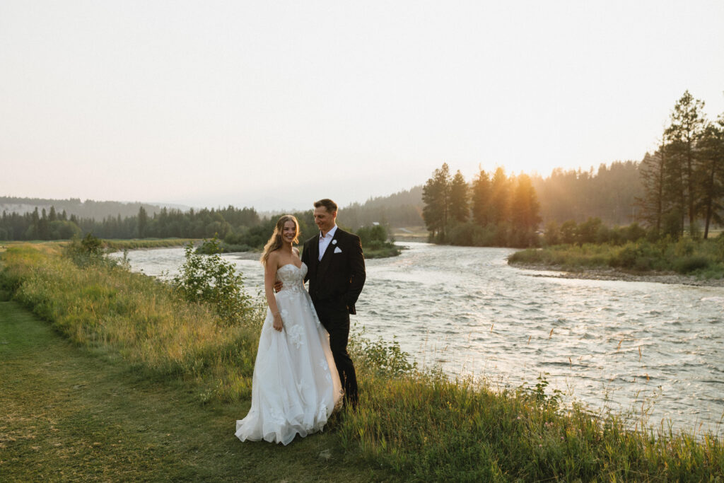 bride and groom at golden hour during st. eugene wedding in cranbrook, bc